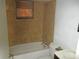 Small bathroom with tile shower surround and basic fixtures at 6030 17Th St, Zephyrhills, FL 33542