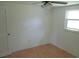 Neutral bedroom with ceiling fan and ample natural light from window at 6030 17Th St, Zephyrhills, FL 33542