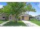 Charming single-story home with well-maintained lawn, covered parking, and mature landscaping at 6030 17Th St, Zephyrhills, FL 33542