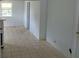 Bright living room with tile flooring awaiting personal touches and decor at 6030 17Th St, Zephyrhills, FL 33542