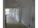 Bright living room featuring tiled floors, an open layout, and freshly painted walls at 6030 17Th St, Zephyrhills, FL 33542