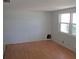 Bright living room with wood-look flooring, awaiting personal touches and decor at 6030 17Th St, Zephyrhills, FL 33542