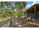 Scenic backyard view with a patio and tranquil waterfront setting at 6410 Amelia Ln, Dade City, FL 33523