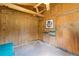 Bedroom featuring wood-paneled walls, a ceiling fan, and a closet at 6410 Amelia Ln, Dade City, FL 33523