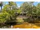 Charming home with a beautiful porch and views of the tranquil river at 6410 Amelia Ln, Dade City, FL 33523