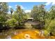 Charming home nestled by the river, offering serene views and a peaceful setting at 6410 Amelia Ln, Dade City, FL 33523