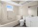 Clean bathroom with a shower over tub, a single sink vanity, and vinyl floors at 6509 Pine Meadows Dr, Spring Hill, FL 34606