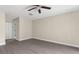 Bedroom featuring modern gray flooring and a ceiling fan for comfortable living at 6509 Pine Meadows Dr, Spring Hill, FL 34606