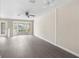 Living room with stylish gray flooring, bay windows and ample natural light at 6509 Pine Meadows Dr, Spring Hill, FL 34606