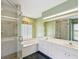 Bright bathroom featuring a shower, tub, and white vanity with marble countertops at 6545 North Lake Dr, Zephyrhills, FL 33542