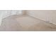 Neutral carpeted bedroom featuring baseboard trim and electrical outlets at 6545 North Lake Dr, Zephyrhills, FL 33542