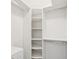 Walk-in closet with built-in shelving and ample storage space at 6545 North Lake Dr, Zephyrhills, FL 33542