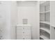 Custom closet with drawers and shelving provides ample storage space at 6545 North Lake Dr, Zephyrhills, FL 33542