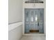 Stylish front door with glass panels and decorative hardware at 6545 North Lake Dr, Zephyrhills, FL 33542