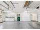 Spacious garage with overhead storage, and plenty of storage units at 6545 North Lake Dr, Zephyrhills, FL 33542