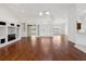 Bright living room with hardwood floors and open access to the kitchen at 6545 North Lake Dr, Zephyrhills, FL 33542