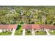 Aerial view of the residential neighborhood with lush trees and well-maintained landscaping at 6590 Brambleleaf Dr, Spring Hill, FL 34606