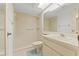Tiled bathroom featuring a shower with glass doors, vanity, and toilet at 6590 Brambleleaf Dr, Spring Hill, FL 34606