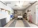 Well-organized garage with a golf cart, shelving, and ample storage space at 6590 Brambleleaf Dr, Spring Hill, FL 34606