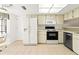 Functional kitchen area with modern appliances, tile flooring and plenty of natural light at 6590 Brambleleaf Dr, Spring Hill, FL 34606