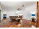 Spacious living room with hardwood floors and lots of seating at 6590 Brambleleaf Dr, Spring Hill, FL 34606