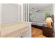 Bedroom with a vanity, built-in shelving, wood floors, and a ceiling fan at 6590 Brambleleaf Dr, Spring Hill, FL 34606