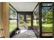 Bright enclosed porch with glass doors providing access to the yard at 6590 Brambleleaf Dr, Spring Hill, FL 34606