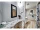 Updated bathroom featuring a vanity with marble countertop and a full mirror at 7118 Cherry Laurel Dr, Port Richey, FL 34668