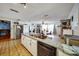 Spacious kitchen with granite countertops, a double sink, and stainless steel appliances at 7118 Cherry Laurel Dr, Port Richey, FL 34668