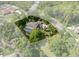 Aerial view of a secluded home with a pool, surrounded by mature trees and lush landscaping at 7268 Crystal Spring Run, Weeki Wachee, FL 34607