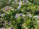 Stunning aerial view of a luxury home featuring a private pool, lush landscaping, and mature trees in a desirable neighborhood at 7268 Crystal Spring Run, Weeki Wachee, FL 34607