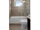 Bathroom featuring a bathtub with glass shower doors and a tiled shower at 7268 Crystal Spring Run, Weeki Wachee, FL 34607