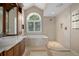 Elegant bathroom featuring a soaking tub, walk-in shower, and decorative tile flooring at 7268 Crystal Spring Run, Weeki Wachee, FL 34607