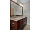 Bathroom featuring a granite countertop vanity with dual sinks at 7268 Crystal Spring Run, Weeki Wachee, FL 34607