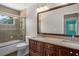 Bathroom features a shower and tub combination, vanity with double sinks, and granite countertops at 7268 Crystal Spring Run, Weeki Wachee, FL 34607
