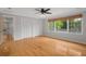 Bedroom with hardwood floors, recessed lighting, and two closets at 7268 Crystal Spring Run, Weeki Wachee, FL 34607