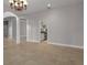 Open floor plan with view from dining room to kitchen through arched doorway at 7268 Crystal Spring Run, Weeki Wachee, FL 34607
