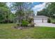 Charming two-story brick home with a three-car garage and well-maintained landscaping at 7268 Crystal Spring Run, Weeki Wachee, FL 34607