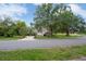 Lovely home with a spacious driveway and lush landscaping, nestled among mature trees in a quiet neighborhood at 7268 Crystal Spring Run, Weeki Wachee, FL 34607