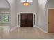 Grand foyer with high ceilings, tile flooring, and a view of the front doors at 7268 Crystal Spring Run, Weeki Wachee, FL 34607