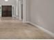 Inviting foyer with tile flooring, decorative pillars, and a view of the arched, double-door entryway at 7268 Crystal Spring Run, Weeki Wachee, FL 34607