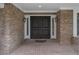 Elegant double front doors with sidelights on a brick home, enhancing its curb appeal at 7268 Crystal Spring Run, Weeki Wachee, FL 34607