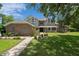 Charming two-story home with a brick facade and a well-manicured front yard at 7268 Crystal Spring Run, Weeki Wachee, FL 34607