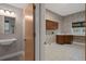 Spacious laundry room featuring custom cabinets, counter space, and a sink at 7268 Crystal Spring Run, Weeki Wachee, FL 34607