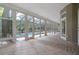 Bright sunroom with tile flooring and views of the pool and outdoor greenery at 7268 Crystal Spring Run, Weeki Wachee, FL 34607