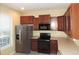Kitchen boasting stainless steel appliances and ample countertop space at 7650 Red Mill Cir, New Port Richey, FL 34653