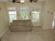 Comfortable living room bathed in natural light with a plush sofa at 7650 Red Mill Cir, New Port Richey, FL 34653