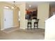 Inviting entryway and open layout with bar-height seating leading to the kitchen at 7650 Red Mill Cir, New Port Richey, FL 34653
