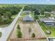 Scenic aerial view of a home with a spacious backyard and a tranquil setting in a residential area at 8199 Nordica Rd, Weeki Wachee, FL 34613