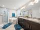 Spacious bathroom with a walk-in shower, bathtub, and double sink vanity at 8199 Nordica Rd, Weeki Wachee, FL 34613